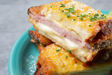 A closeup view of a monte cristo sandwich.