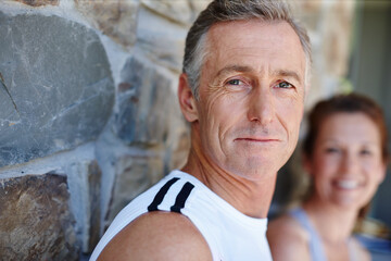 Fitness, happy and portrait with mature couple outdoor on brick wall for running or training...