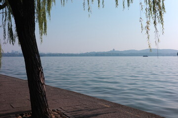 Beautiful scenery and pleasant people by the West Lake in Hangzhou, Zhejiang, China