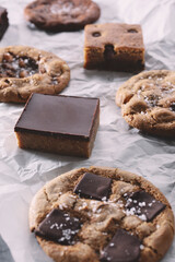 A view of several cookies on crumpled paper liner.