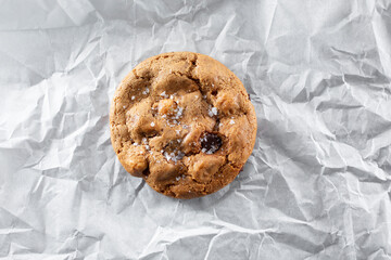 A top down view of a chocolate chip cookie.