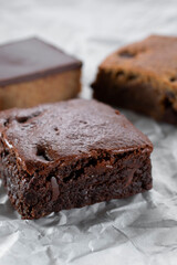 A view of several dessert bars, featuring a brownie.