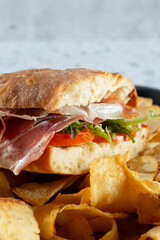 A closeup view of a prosciutto sandwich.