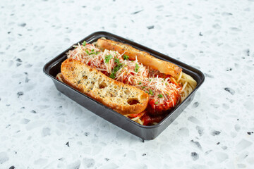 A view of a entree of spaghetti and meatballs.