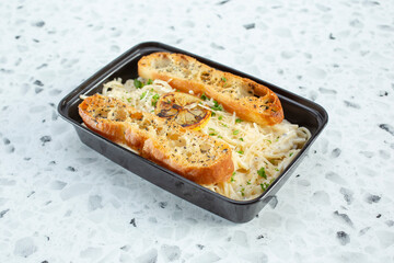 A view of a container of lemon mascarpone pasta.