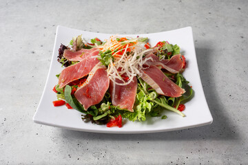 A view of a seared tuna sashimi plate.