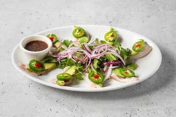 A view of a plate of sashimi yellowtail.