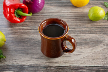 A view of a brown coffee mug.