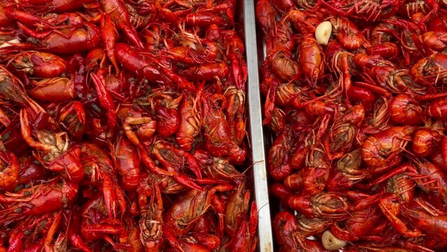 Boiled crayfish on an iron plate. Boiled red crayfish background. top view.