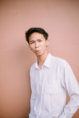 A man whistling, captured in a moment of joy or concentration, expressing himself through a melodic...