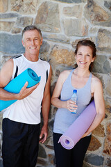 Happy couple, portrait or mat for yoga, fitness or support for pilates, workout or exercise by brick wall. Mature, gym or proud people with smile, teamwork or healthy wellness for training for class