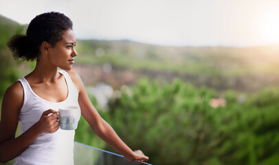 Black woman, thinking and balcony with coffee in relax for morning, breakfast or natural view of neighborhood. Calm African person or girl in wonder with beverage or cappuccino on terrace at home