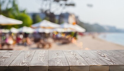 Naklejka premium Breezy Evenings: Wooden Table with Bokeh Beach Café Background