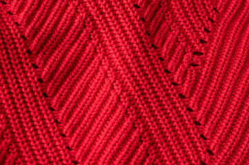 Red knitted mesh fabric texture, close up