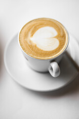 Cup of Coffee, Foam Heart, Close-up, Blurred Background.