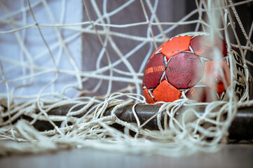 A handball ball in the net