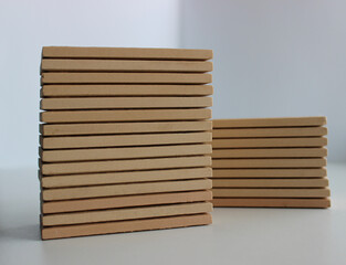 Two pallets of beige ceramic tiles isolated on white stock photo 
