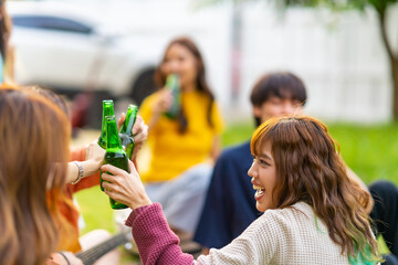 Group of young Asian woman enjoy and fun celebration meeting party at home backyard with playing...