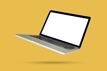 Laptop with blank screen isolated on yellow background