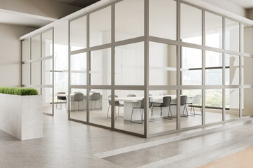 Modern meeting room interior with table and seats, panoramic window