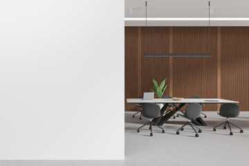 Modern office room interior with meeting board and laptop, mock up wall