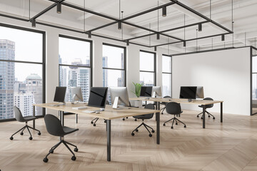 Office coworking interior with pc computers and desks in row, panoramic window