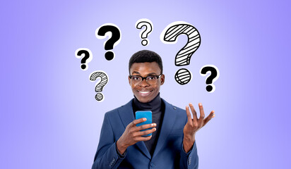 Black businessman using smartphone, hand gesture at question marks