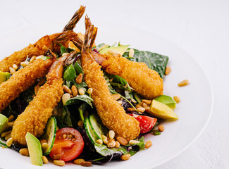 Crispy breaded shrimp salad with fresh vegetables