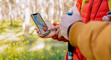Hikers Using GPS Navigation on Smartphone