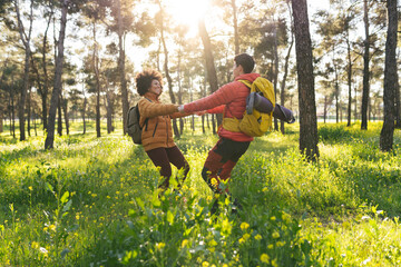 Fototapeta premium Couple Dancing and Laughing in Forest
