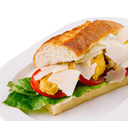 Fresh baguette sandwich on white plate