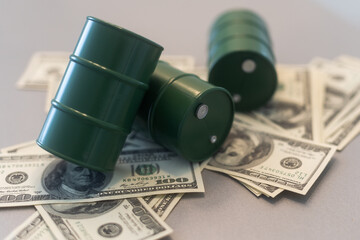 a barrel and dollar bills on a white background.