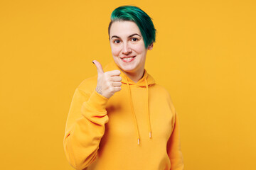 Young smiling cheerful fun happy cool woman with dyed green hair wear hoody casual clothes showing...