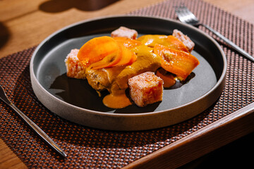 Gourmet seared salmon dish on elegant table setting