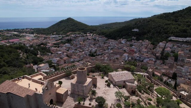 Aerial View of Capdepera City With Mountain Backdrop