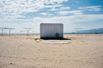 Polyester container cabin, hut or shed on the sandy beach.