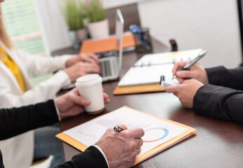 Group of three people working together