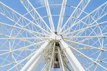 Centre spokes of a large white Ferris Wheel