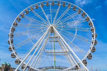 Large White Ferris Wheel with a blue sky
