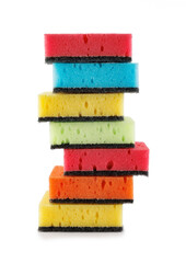Several household sponges isolated on a white background. Stack of sponges for washing dishes.
