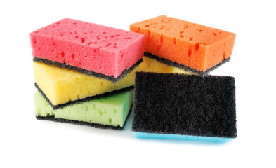 Several colored dishwashing sponges isolated on a white background.