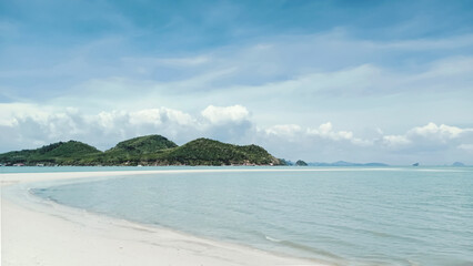 Long curved smooth sandy beach and island views. The beauty of tropical nature. Sea tourism.