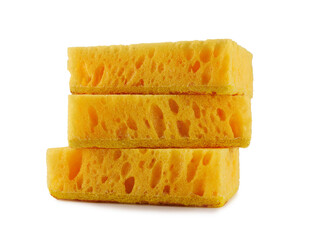 A stack of yellow dishwashing sponges isolated on a white background.