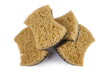 Beautifully arranged curly sponges for washing dishes isolated on a white background. Household cleaning sponge.