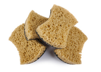 Beautifully arranged curly sponges for washing dishes isolated on a white background. Household cleaning sponge.