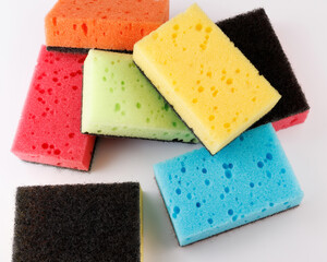 A multi-colored cleaning sponge scattered across the surface. Multi-colored household sponge.