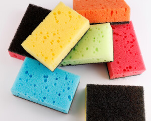 A multi-colored cleaning sponge scattered across the surface. Multi-colored household sponge.
