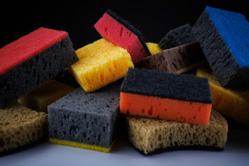 Background of mixed colorful sponges. Household cleaning sponge.