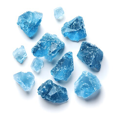 Obraz premium Top view blue crystals scattered isolated on white background