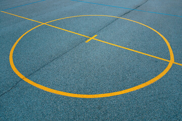 Center circle on outdoor basketball court lines and markings on concrete flooring, street ball abstract background